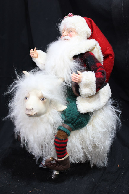 452b - Santa riding a white goat