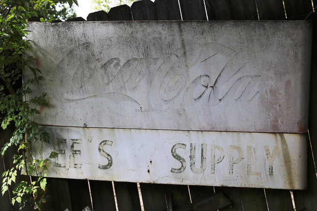 410a - Faded Lee's Supply and Coca Cola sign